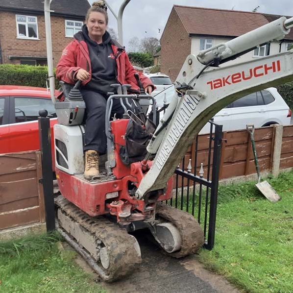 Pamela Evans wearing Crafter trousers on digger